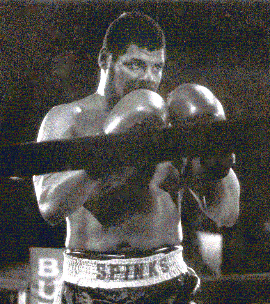 Leon Spinks in the ring. Beside the lion-bodied sphinx, the boxer gives the near-matching sound a second, human identity.
